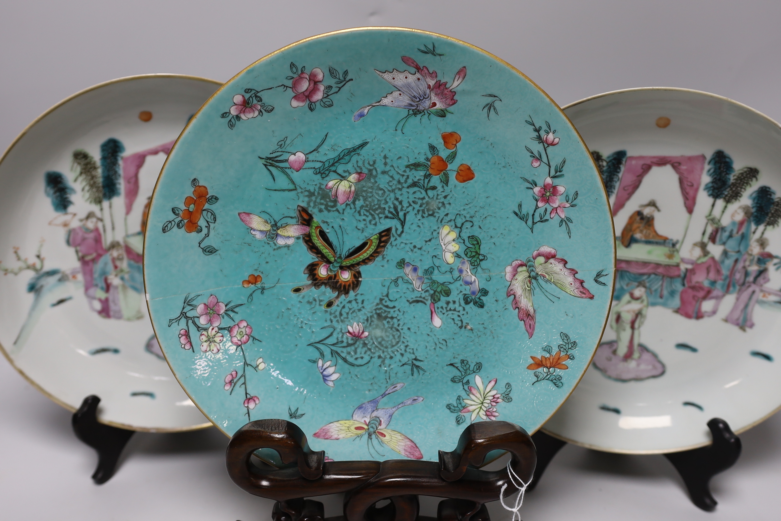 A pair of Chinese famille rose dishes painted with court scenes, a similar enamelled butterfly dish and an ‘immortals’ bowl, all 19th century